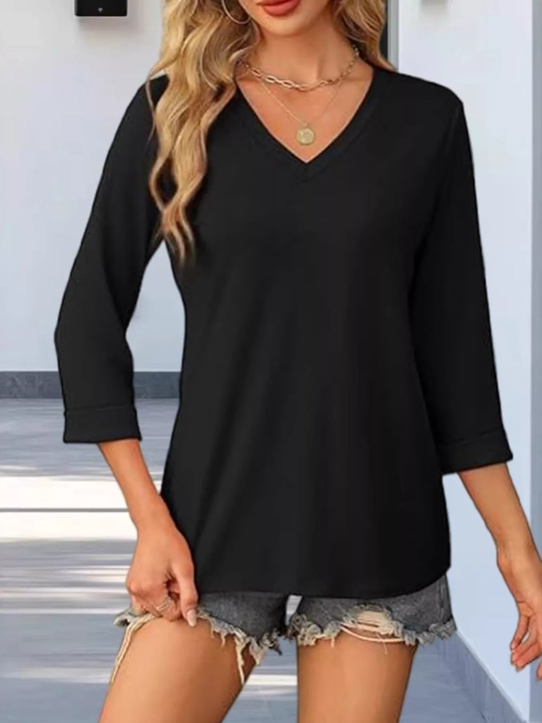 Black V-neck 3/4 sleeve relaxed top with cuffed hem