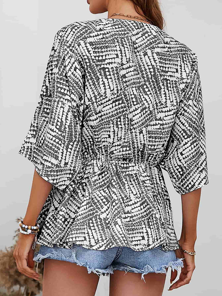 Abstract print V-neck dolman sleeve blouse