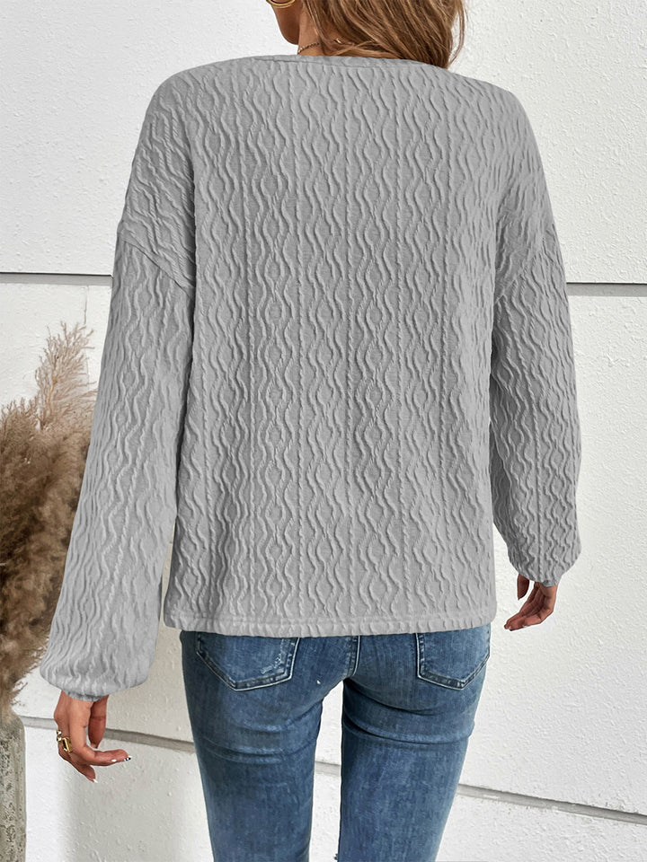 Textured half-button henley top with long sleeves