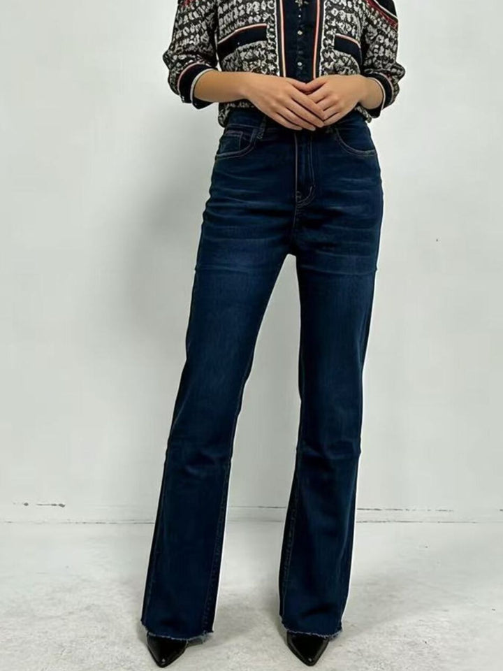 High-rise bootcut jeans with yoke seam and raw hem