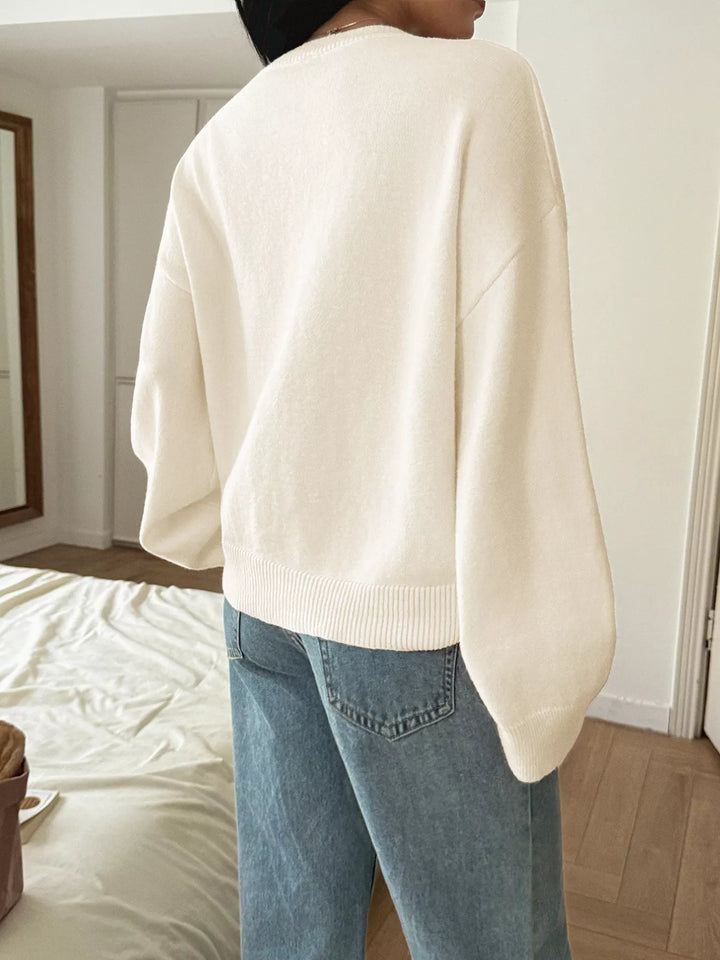 V-neck loose knit sweater with ribbed trim
