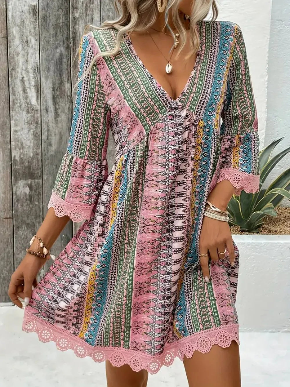 Boho printed mini dress with lace trim and bell sleeves
