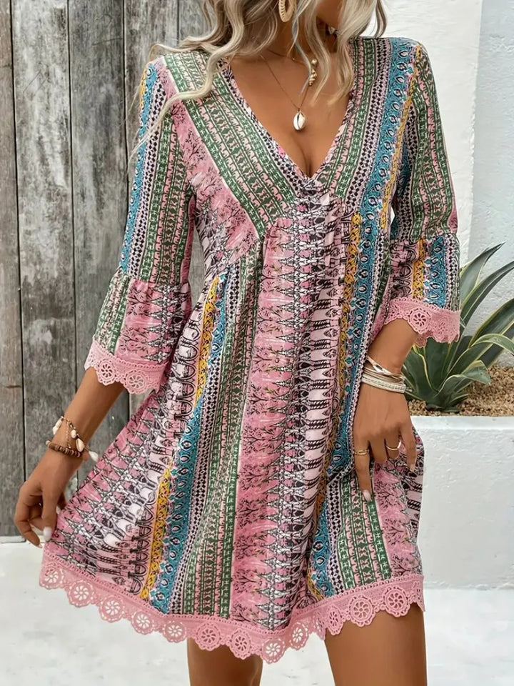 Boho printed mini dress with lace trim and bell sleeves