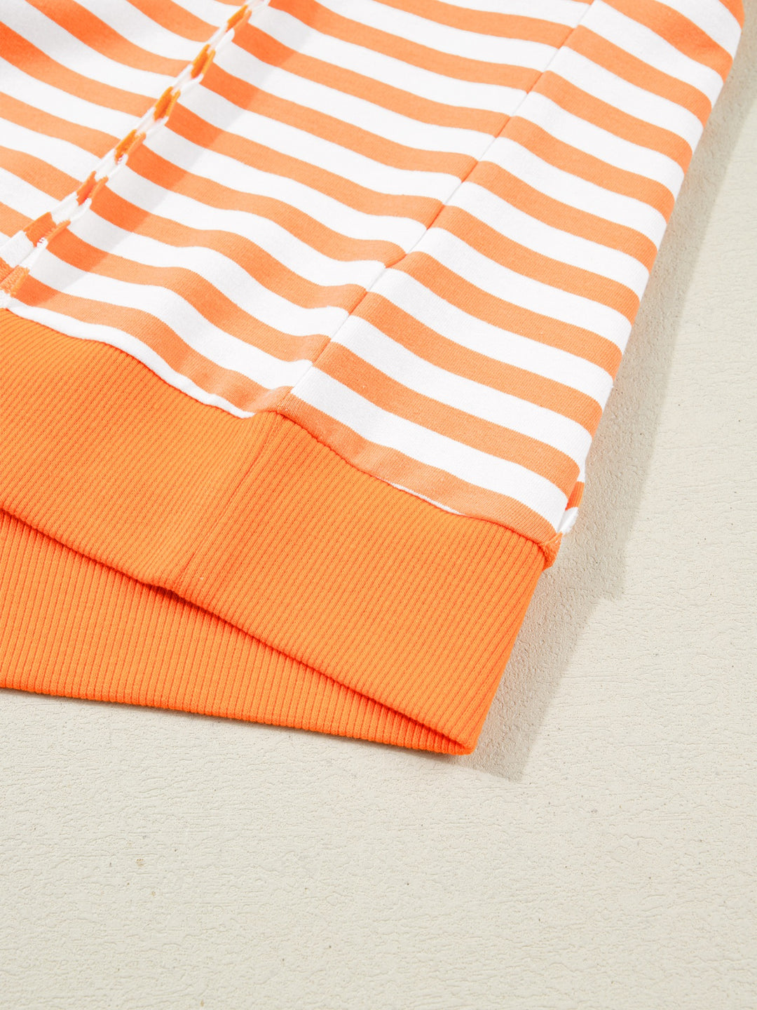 Striped exposed-seam 3/4 sleeve pullover top