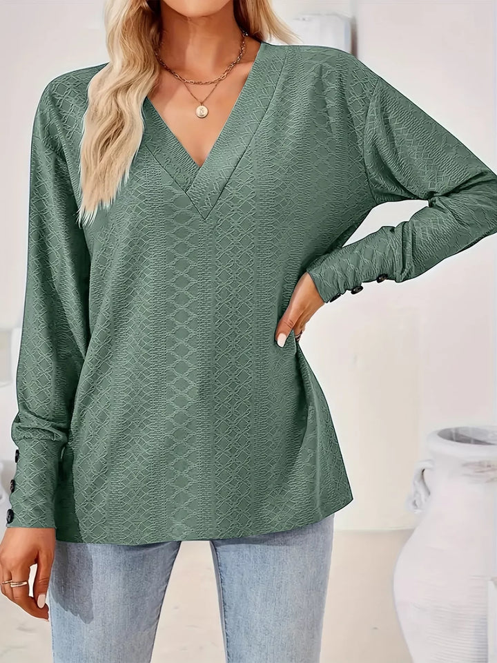 Plus size textured V-neck long sleeve top with button cuffs