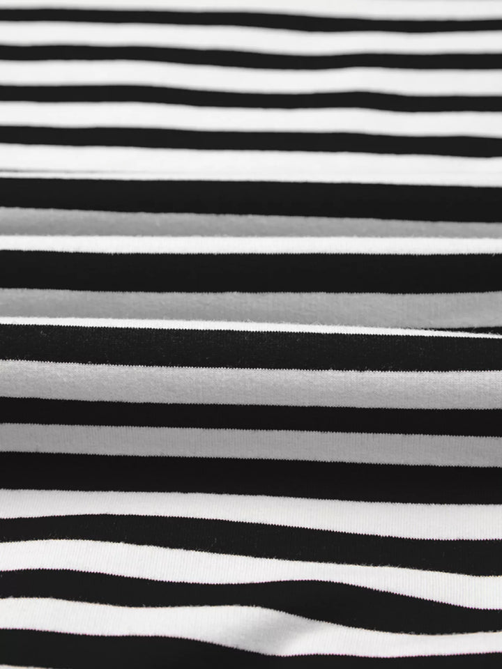 Exposed seam striped drop-shoulder pullover top
