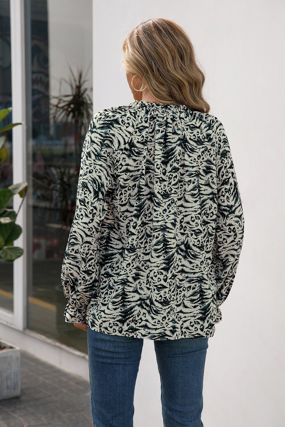 Animal print tie-neck blouse with flounce sleeves