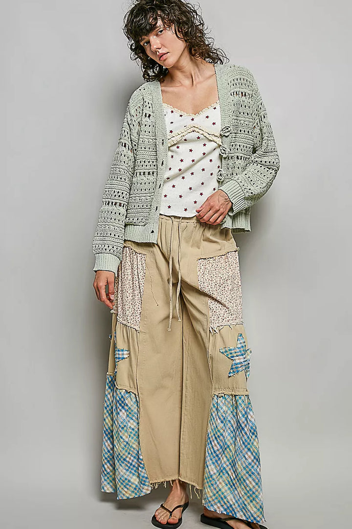 Open-knit V-neck cardigan with 3D floral buttons