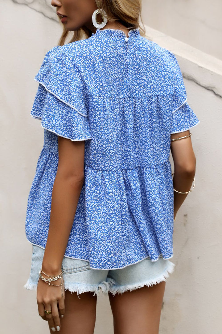 Ditsy floral peplum blouse with layered flutter sleeves