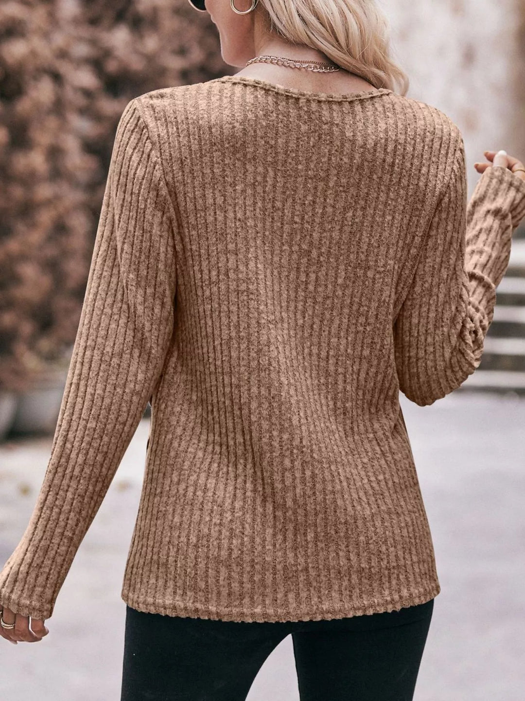 Ribbed knit long sleeve top with side button hem