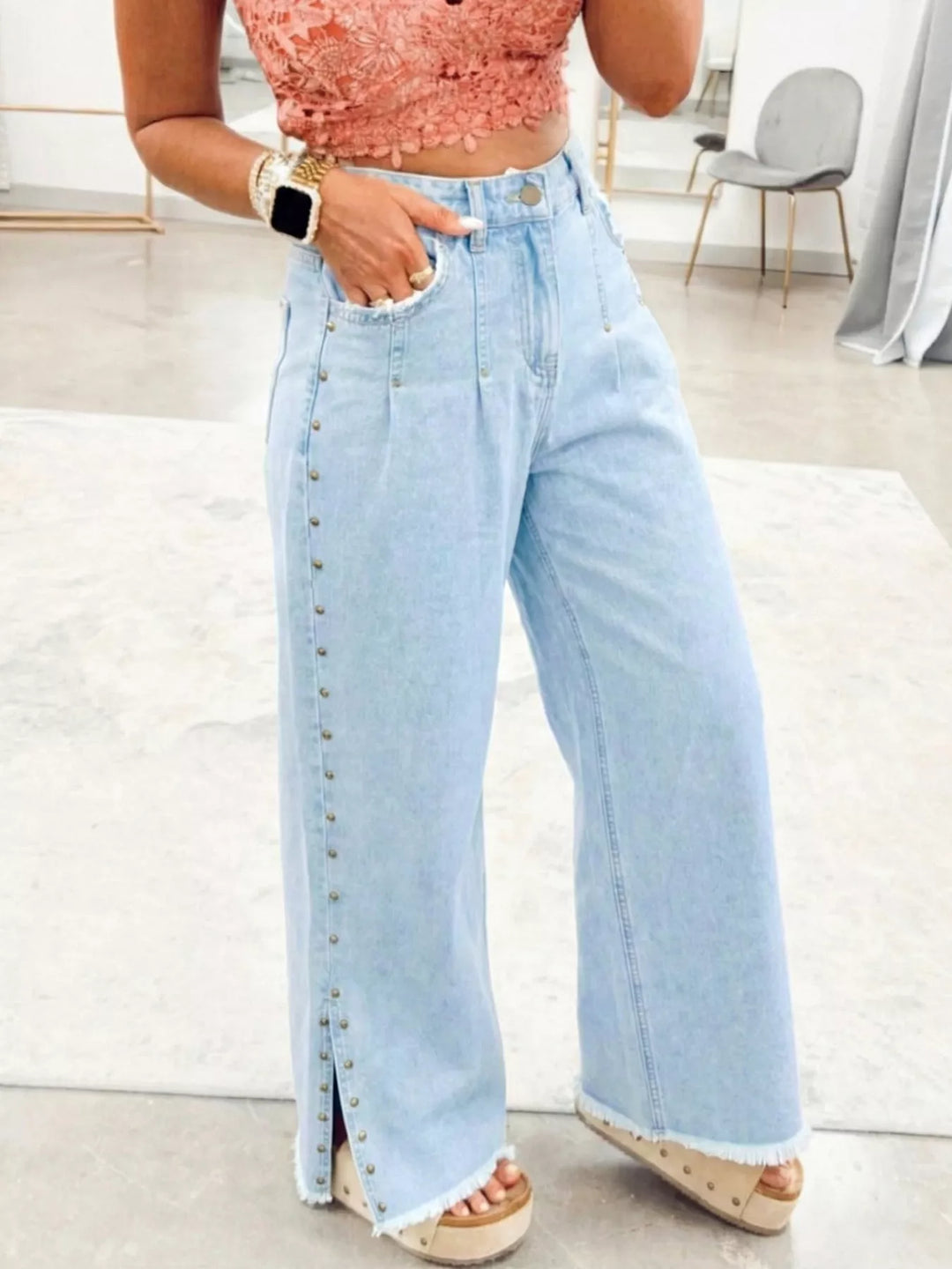 Studded wide leg jeans with side slits and frayed hem