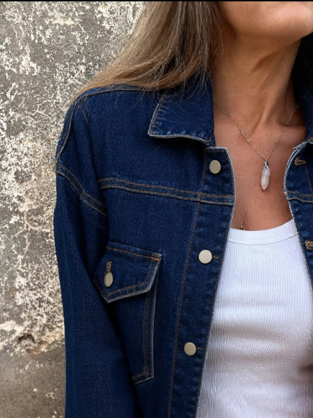 Classic button-up denim jacket with chest flap pockets