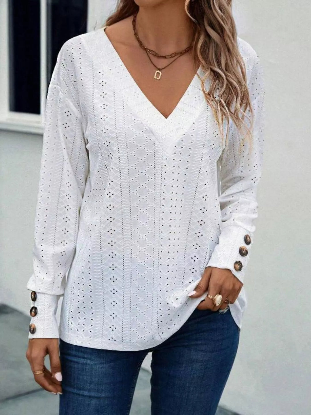 Eyelet V-neck long sleeve top with button cuffs