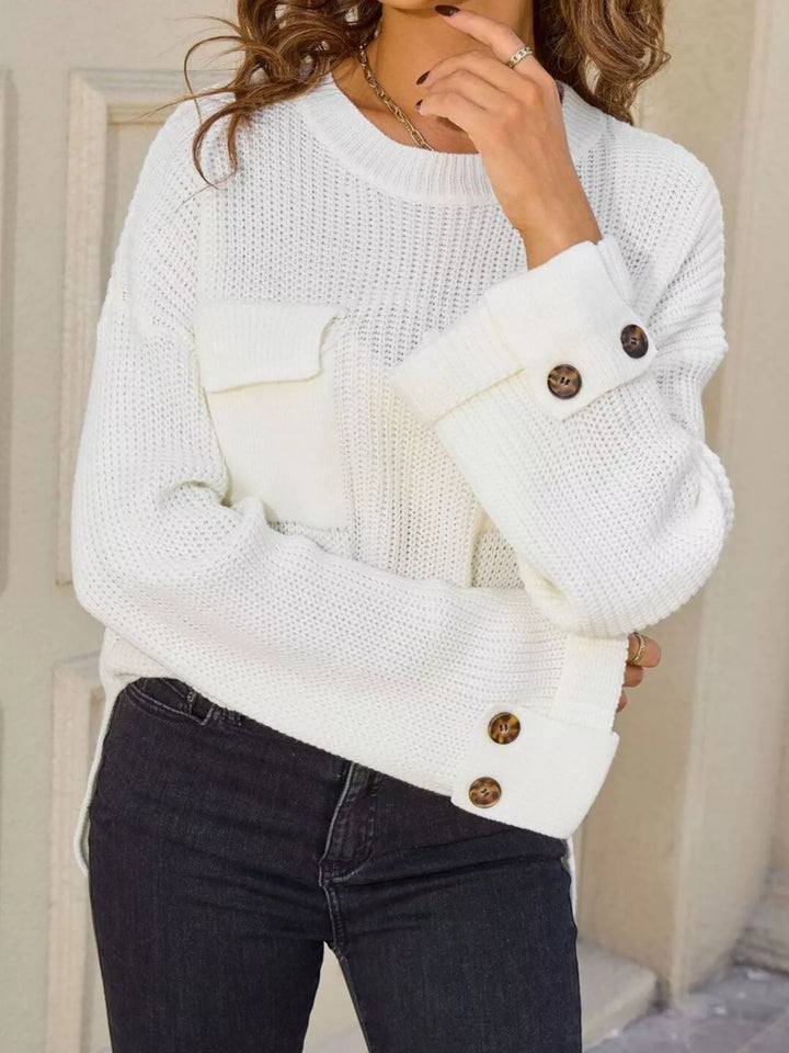 Ribbed knit sweater with chest pockets and button cuffs