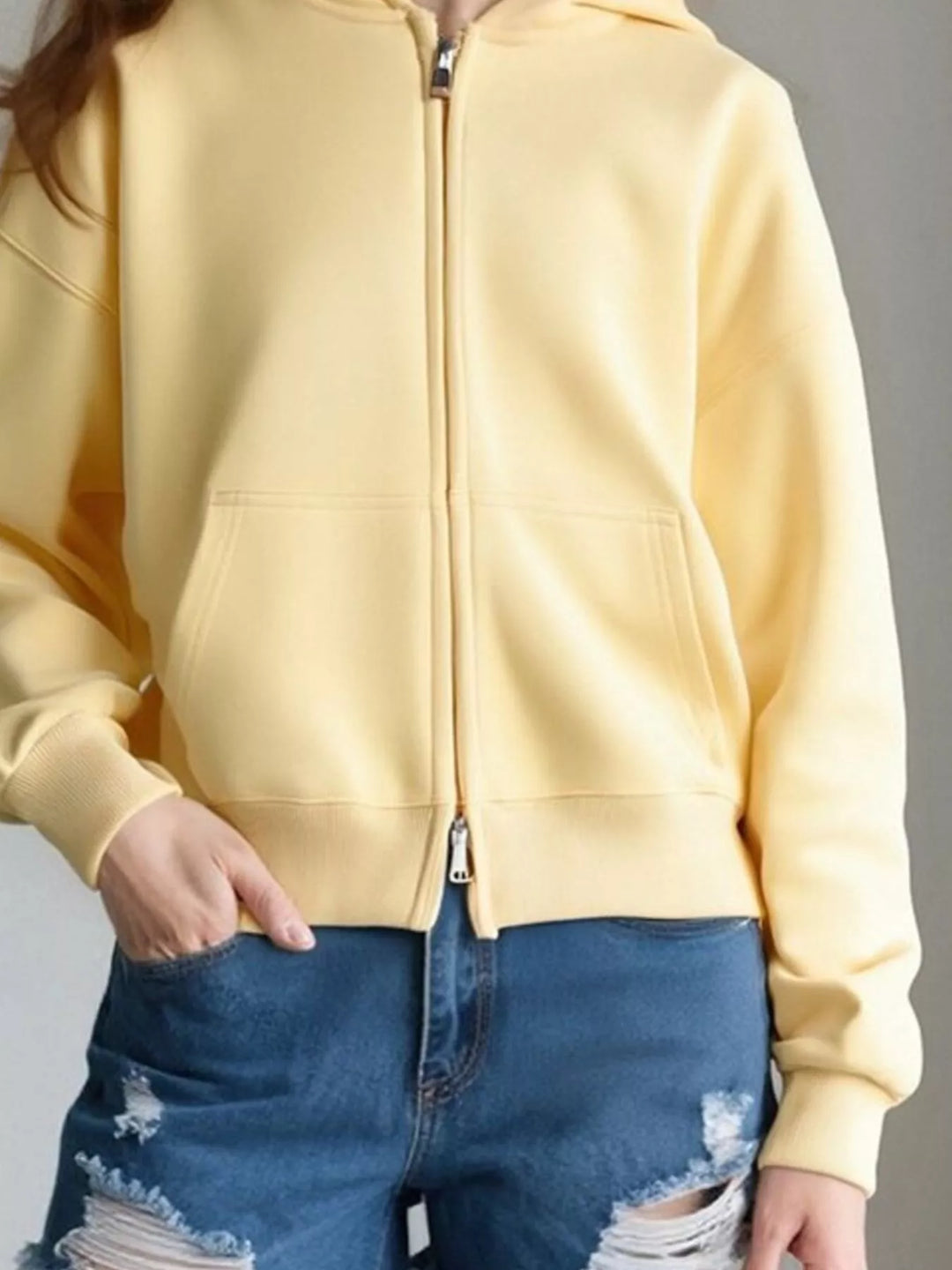 Zip-up hoodie with front pockets and ribbed cuffs