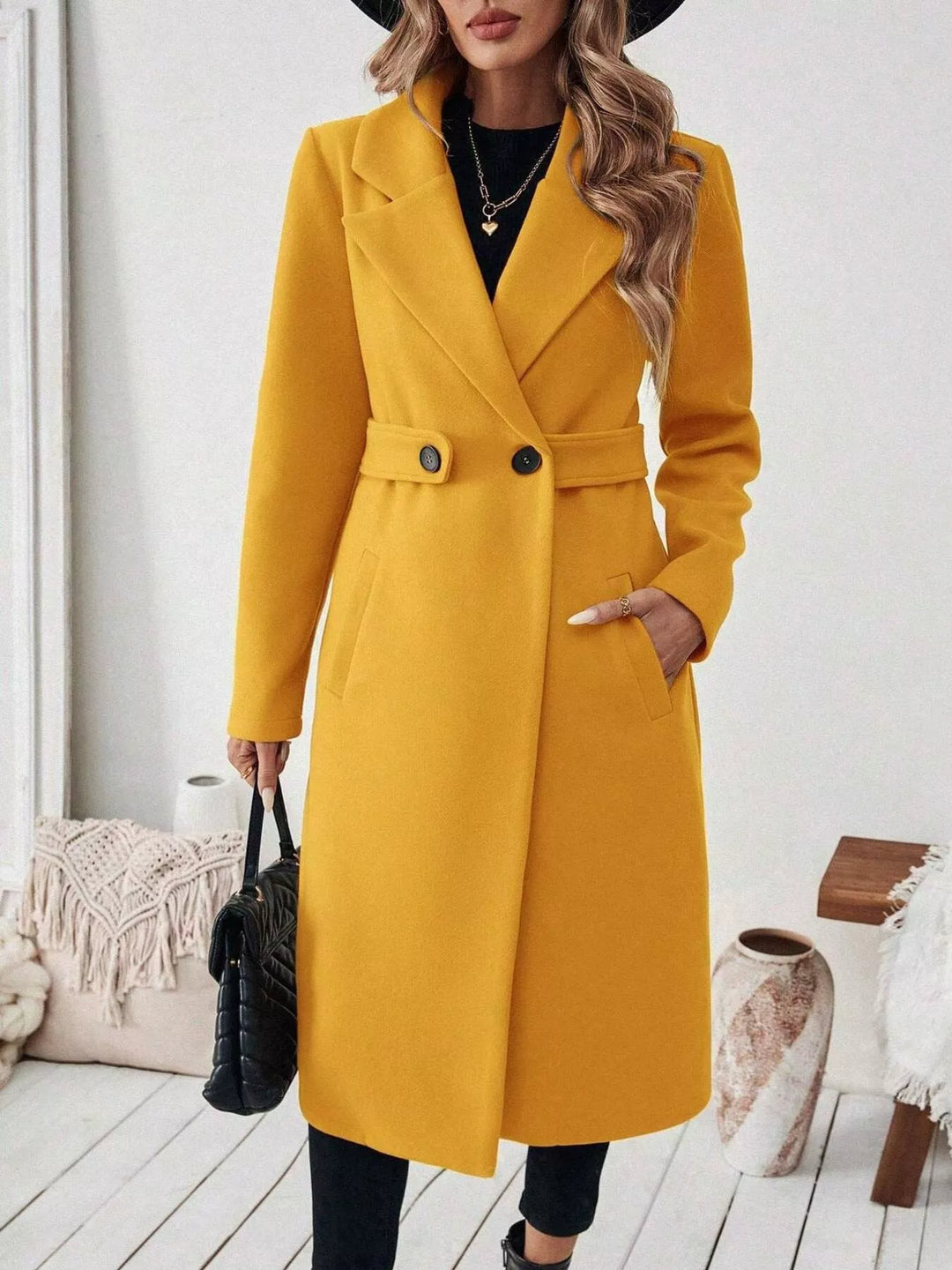 Longline notch lapel coat with single-button waist tab