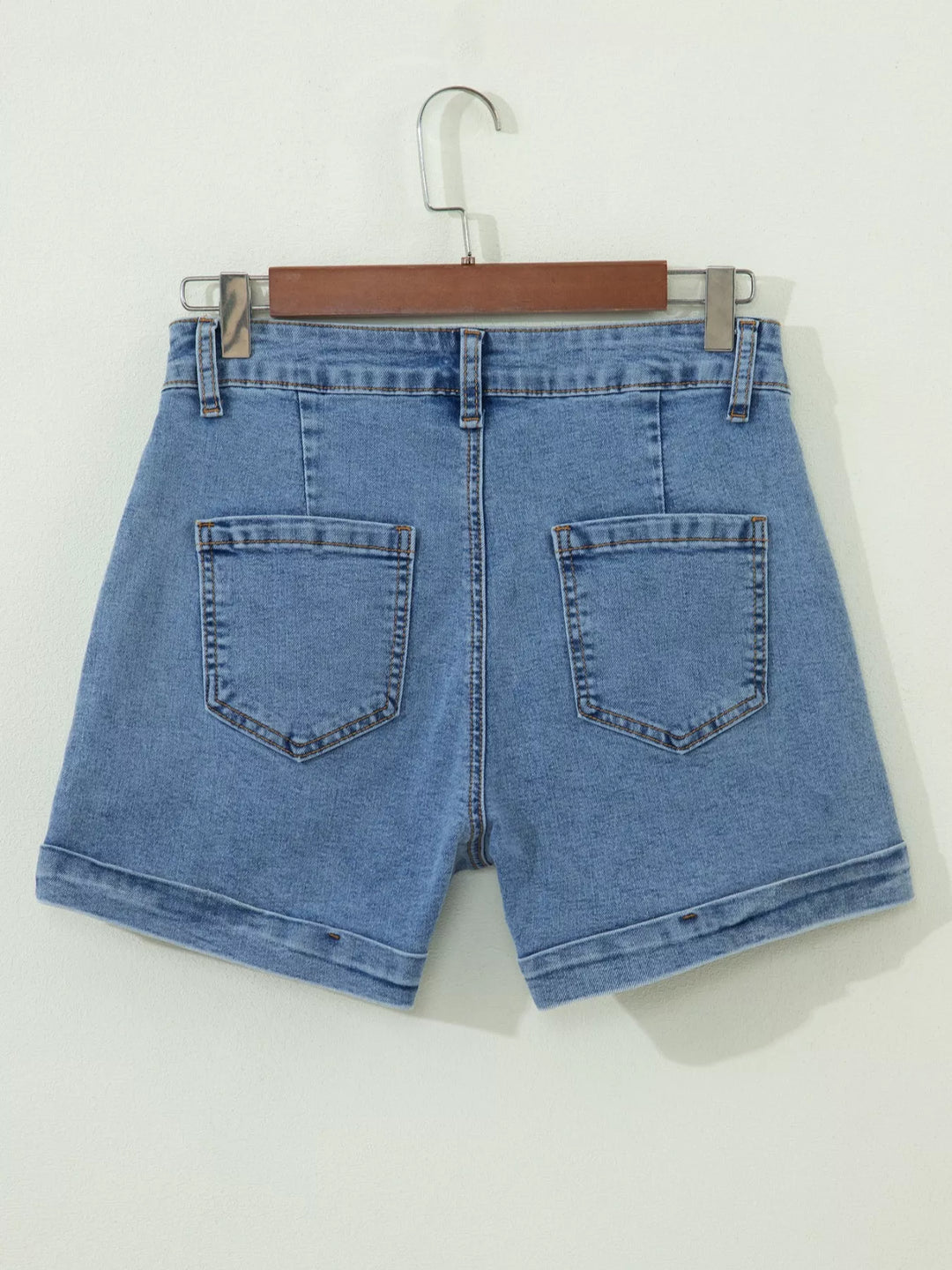 High-rise cuffed denim shorts with double-button waist