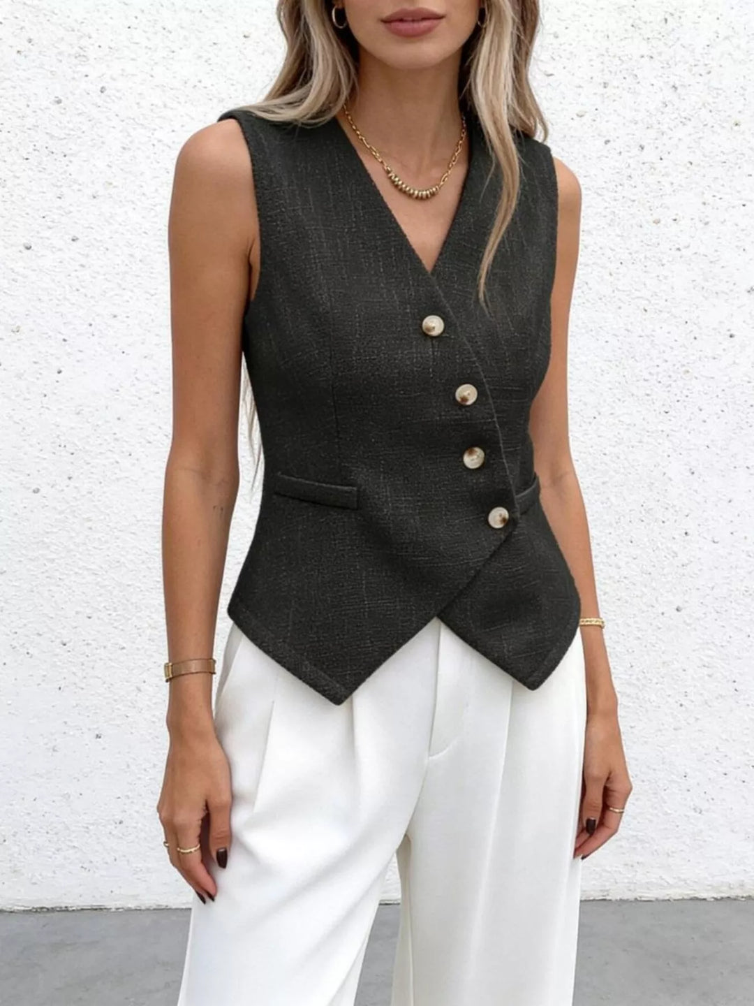 Asymmetrical sleeveless vest with diagonal button placket
