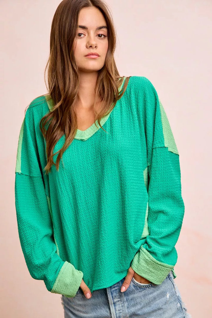 Color block long sleeve textured jersey top with raw-cut edges