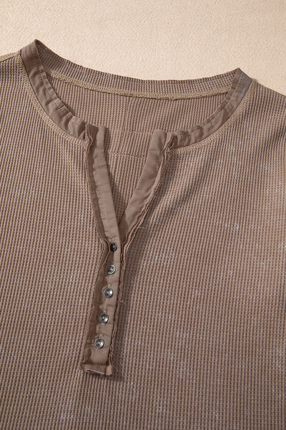 Waffle knit henley top with long sleeves and button placket