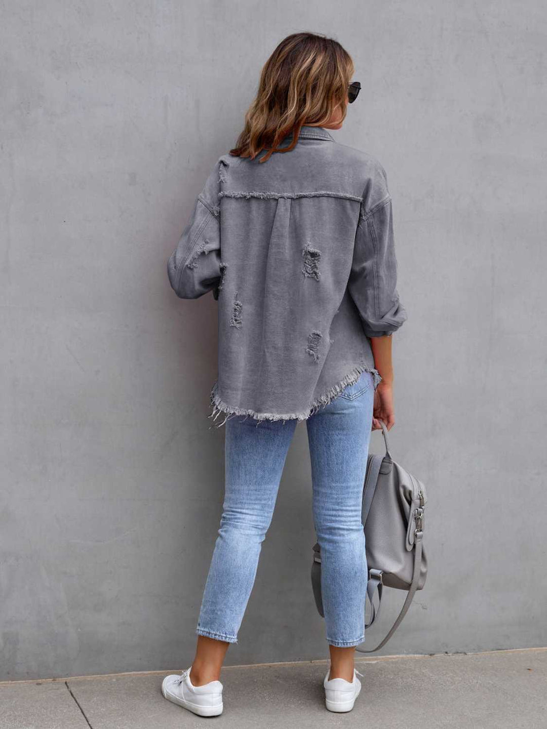 Distressed drop shoulder denim jacket with fringe hem