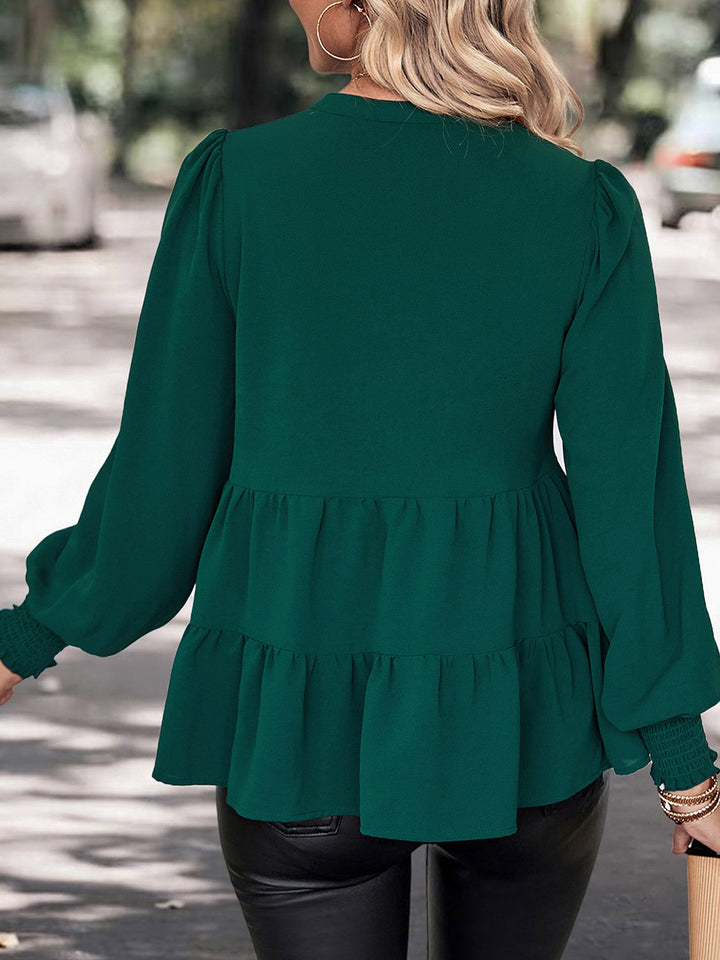 Tiered peplum blouse with notched neck and lantern sleeves