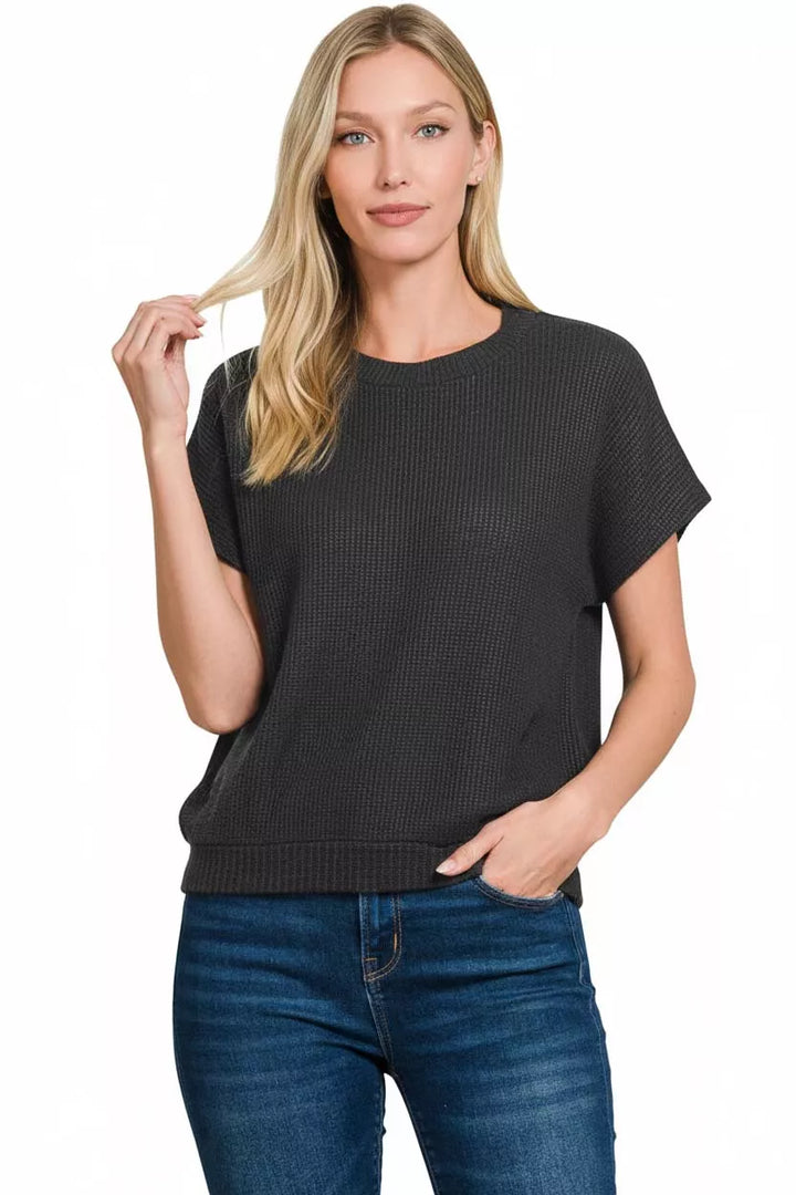 Waffle knit short sleeve sweater with banded hem