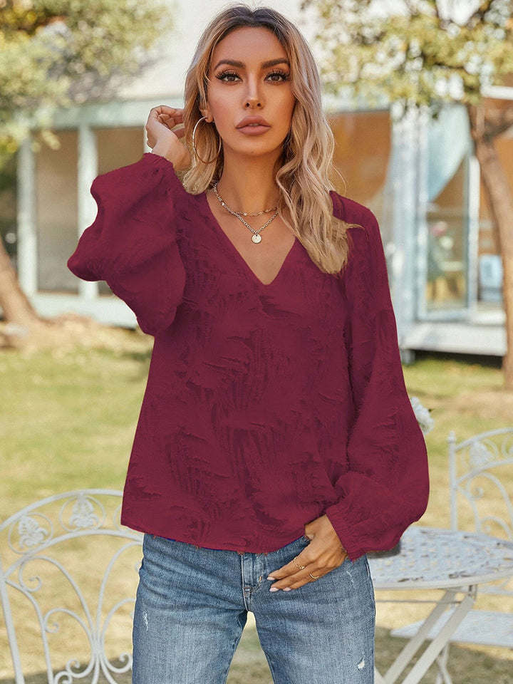 Burgundy Textured v-neck blouse with balloon sleeves