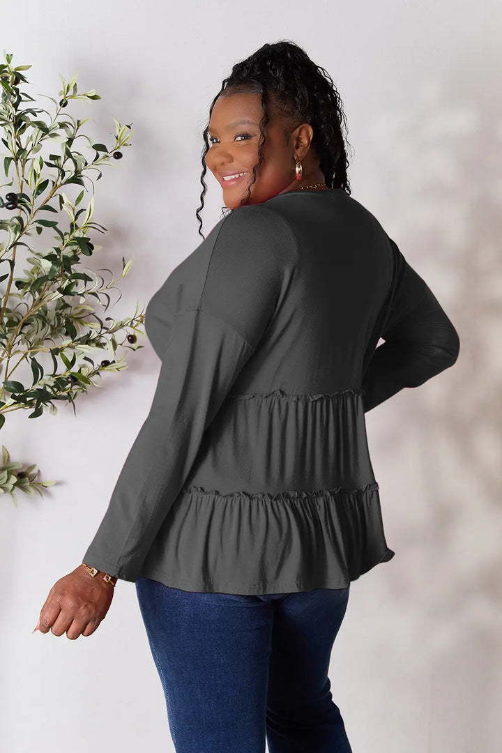 Half-button long sleeve blouse with tiered ruffle hem