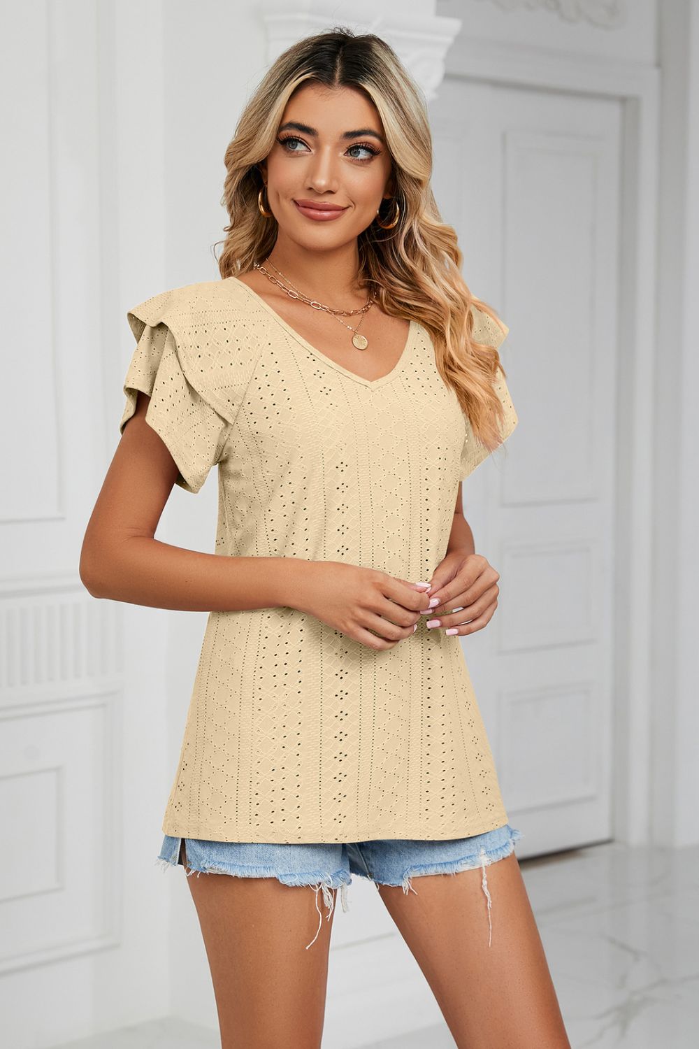 Eyelet knit V-neck top with layered flutter sleeves
