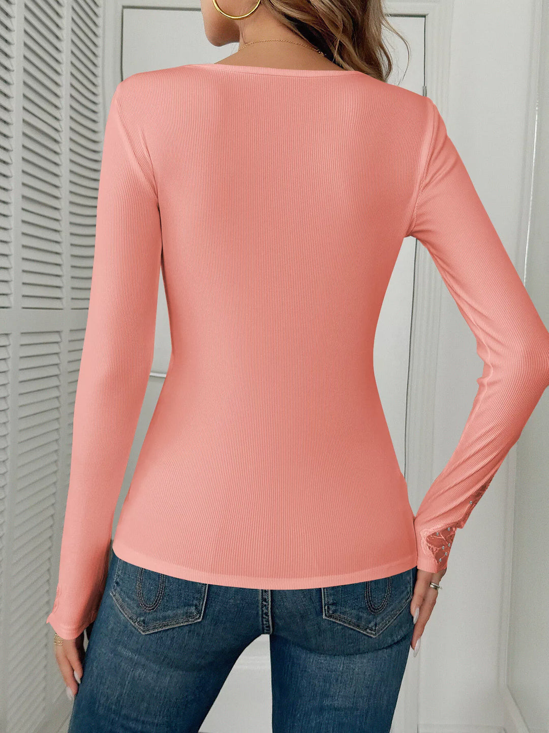 Ribbed knit top with floral lace trim and rhinestones