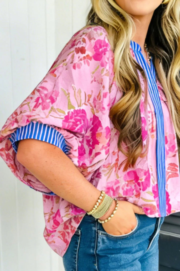 Floral relaxed blouse with striped V-neck and cuff trim