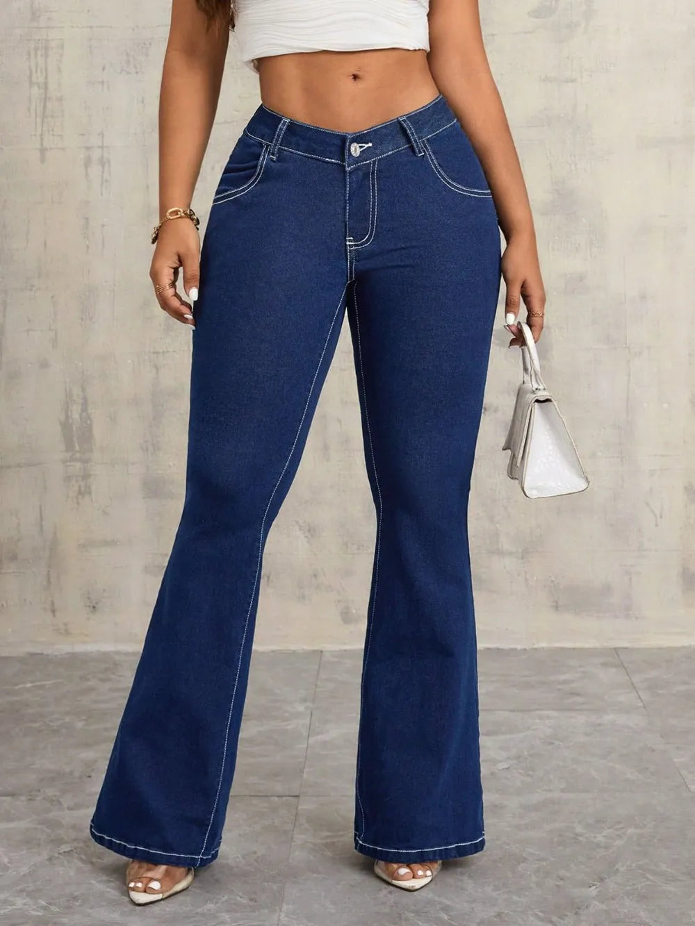Dark V-notch waist flare jeans with contrast stitching