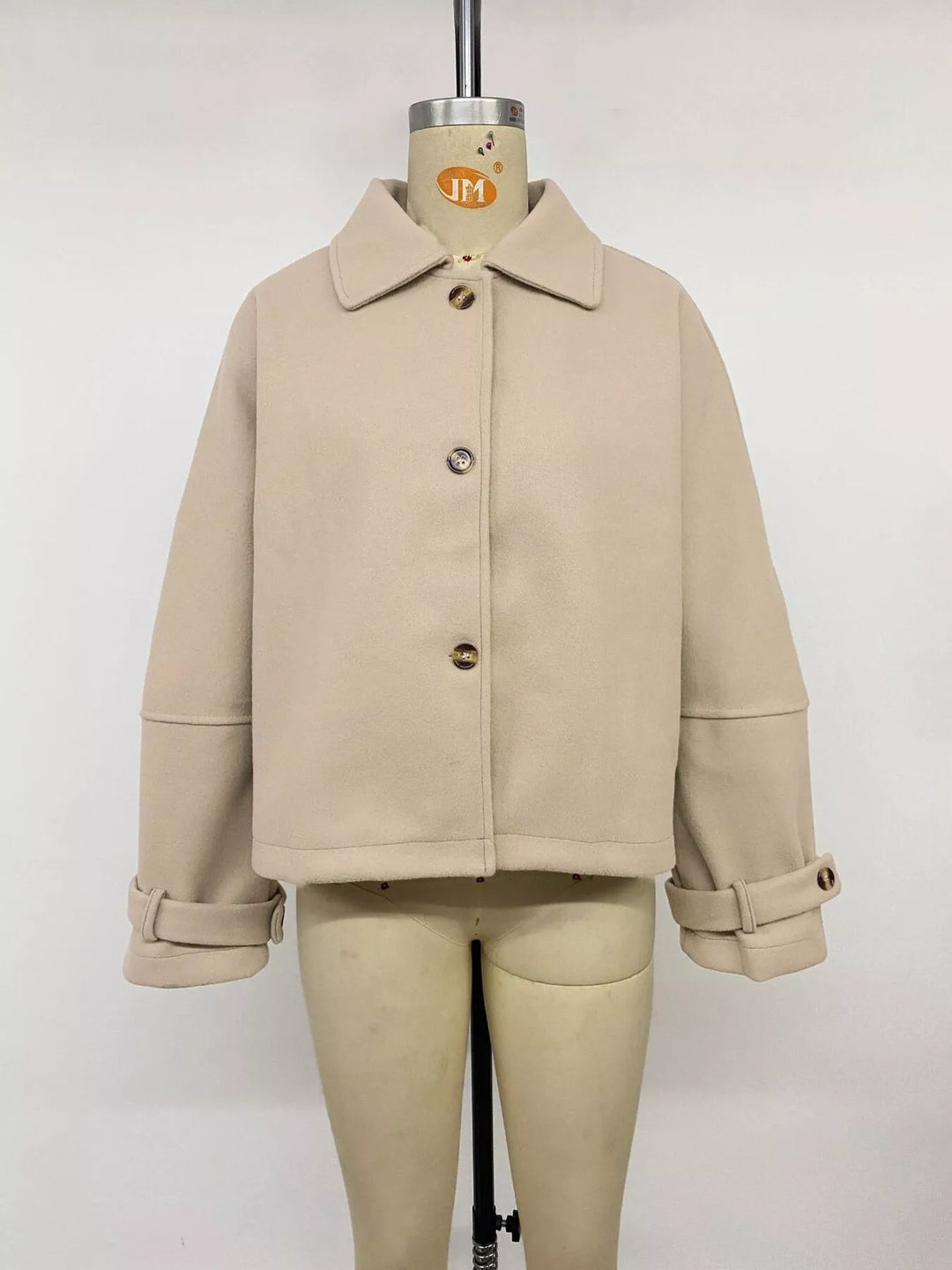 Cropped collared button-up jacket with cuff tabs