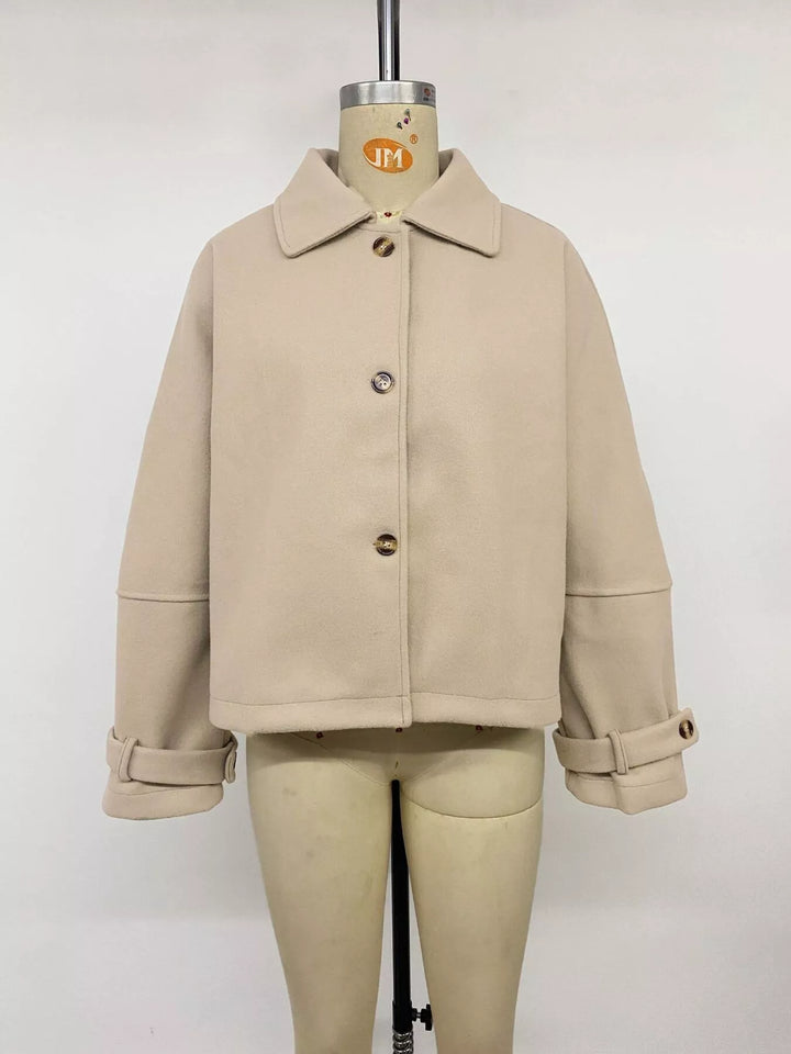 Cropped collared button-up jacket with cuff tabs
