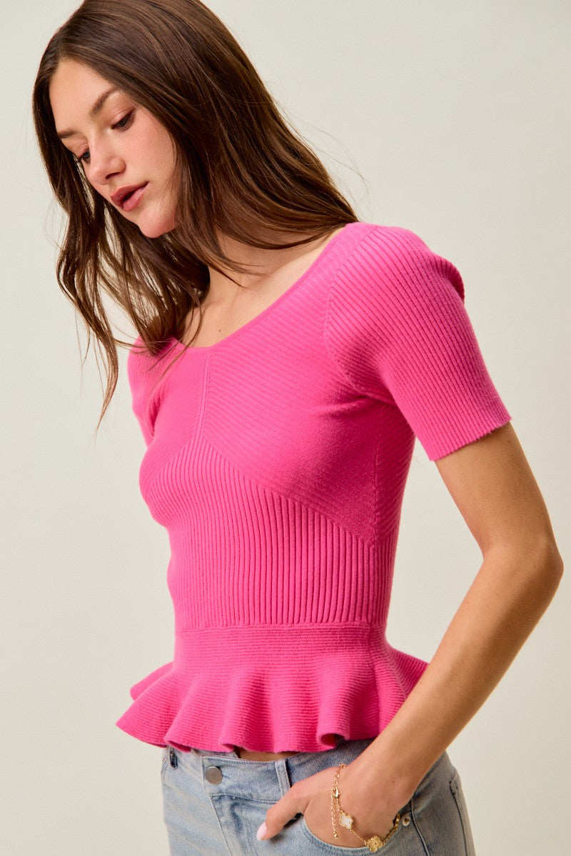 Ribbed knit peplum top with short sleeves and scoop neck