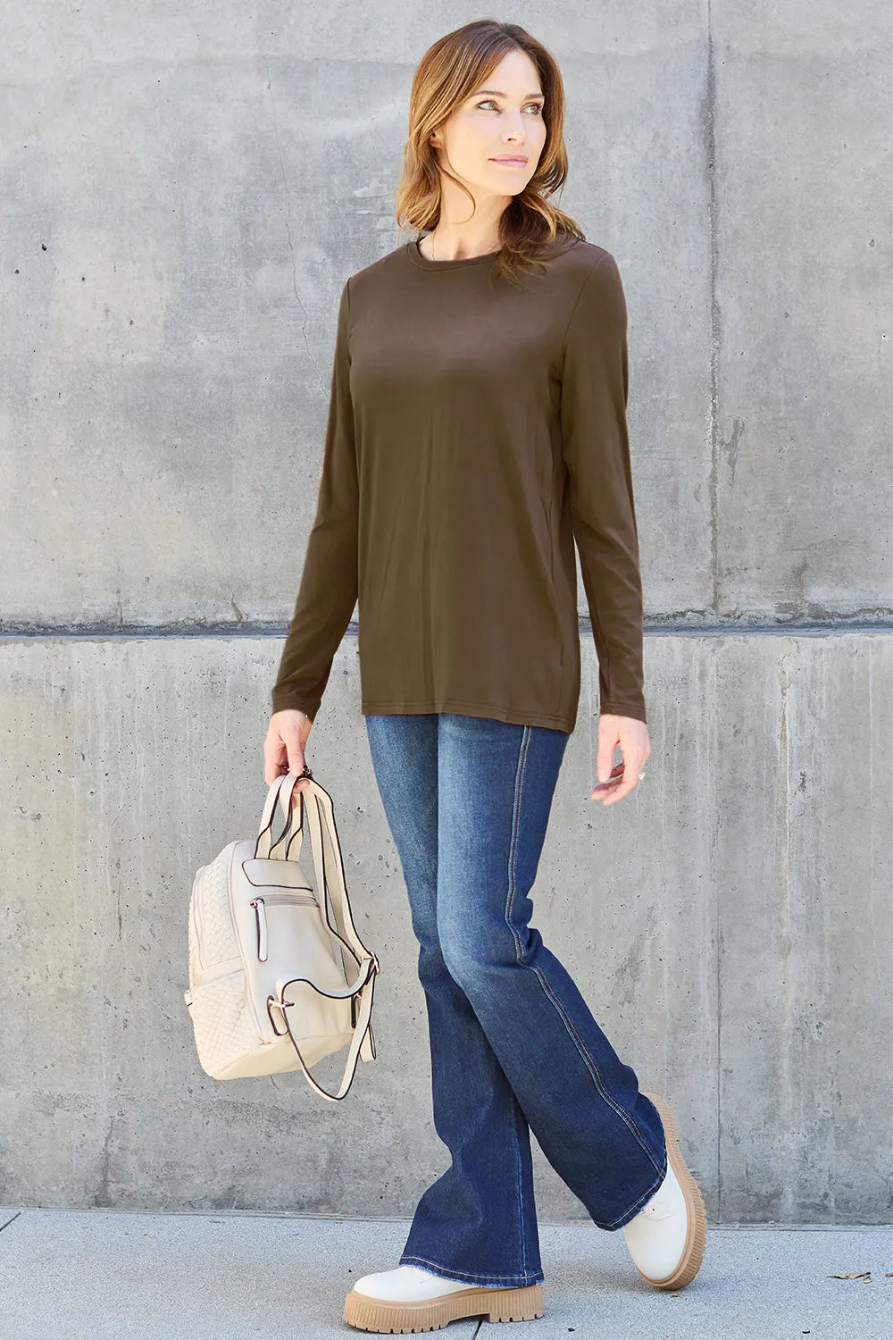 Crew neck long sleeve top with curved hem