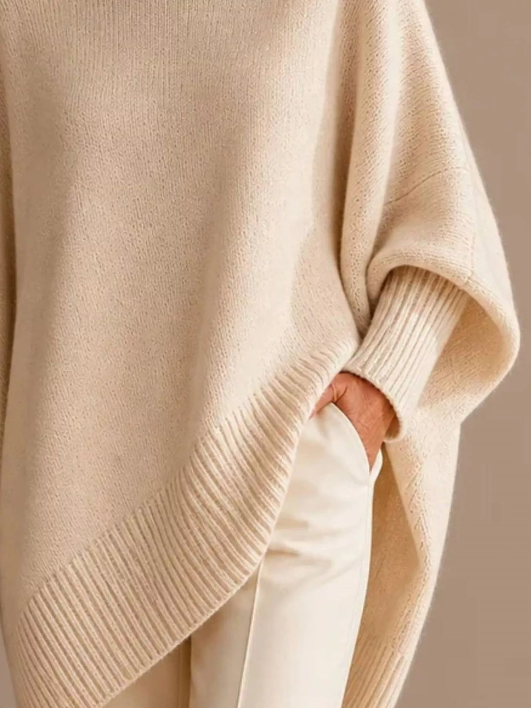 Batwing sleeve asymmetric hem oversized knit sweater