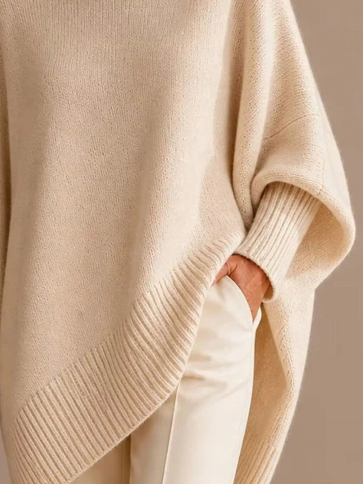 Batwing sleeve asymmetric hem oversized knit sweater