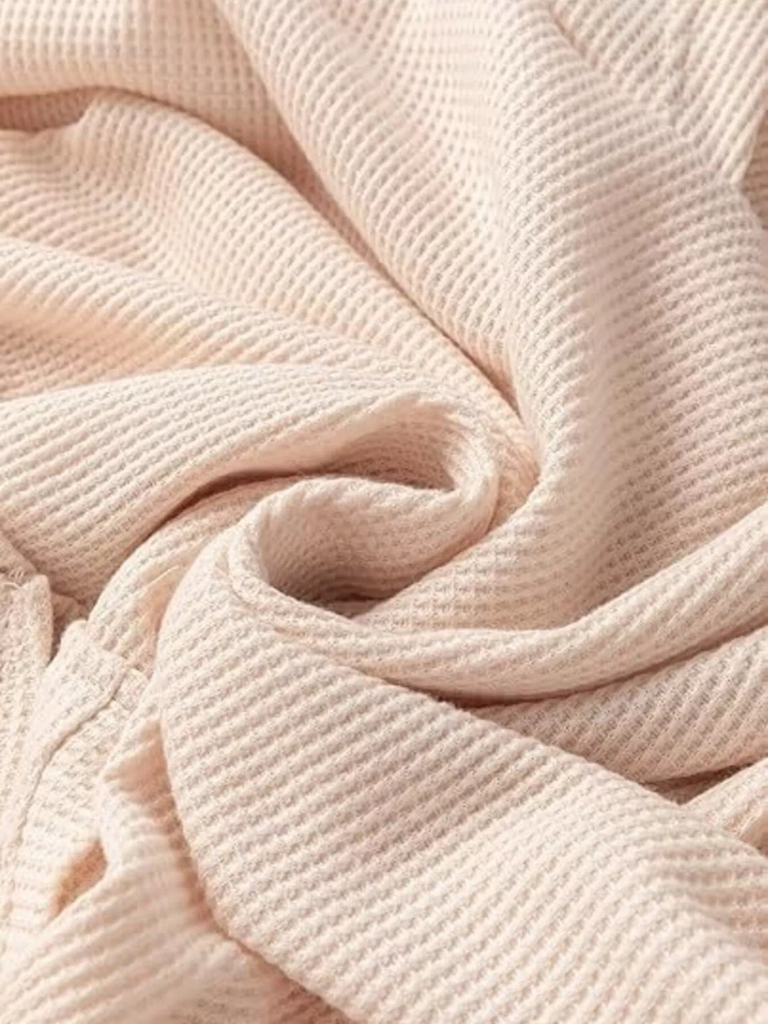 Oversized waffle-knit hoodie with side slits and front pocket