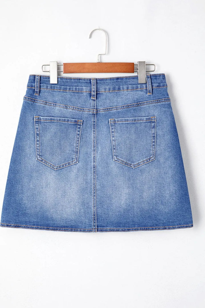 Wrap-front denim mini skirt with angled hem seam