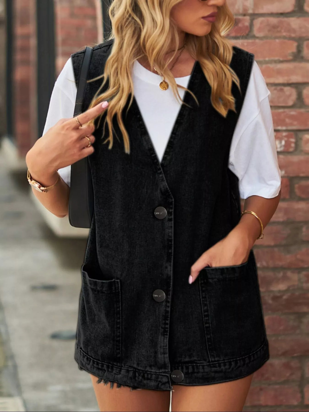 Black Sleeveless button-down denim vest with patch pockets