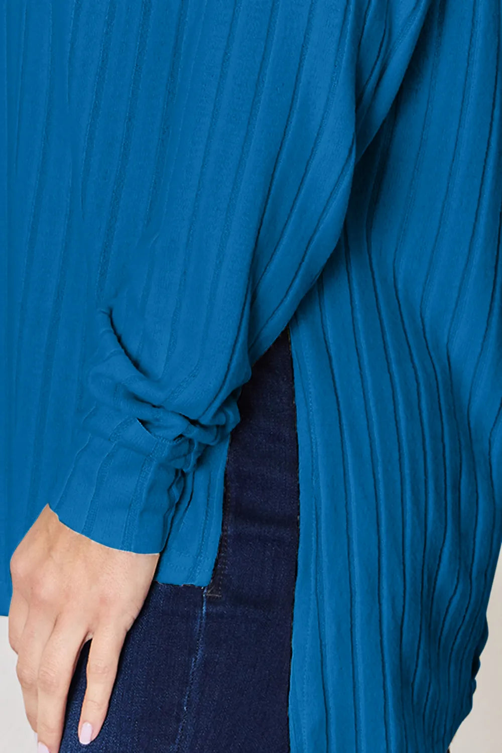 Ribbed knit round neck long sleeve top with side slits