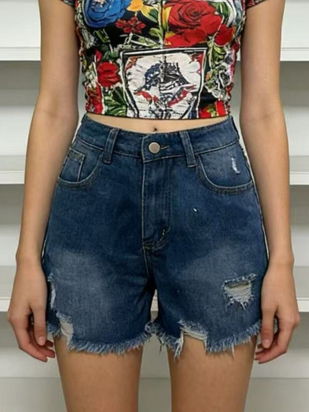 Distressed high-rise denim shorts with frayed raw hem