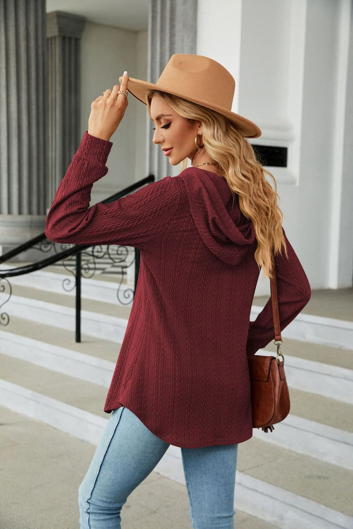 Cable knit hooded top with tie neck and button placket