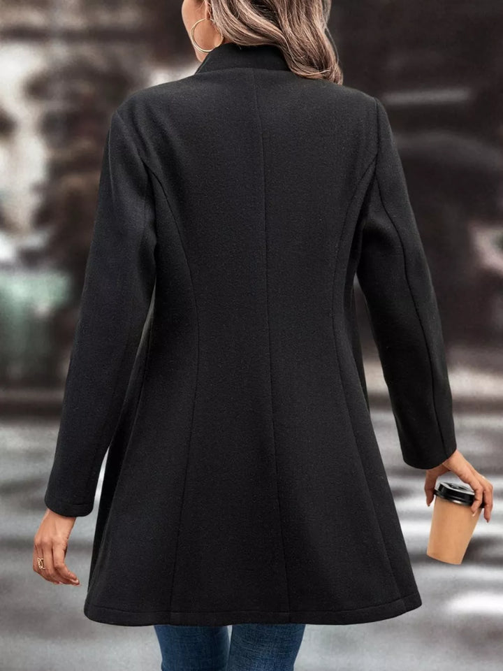 Button-front longline coat with notched lapel and flared hem