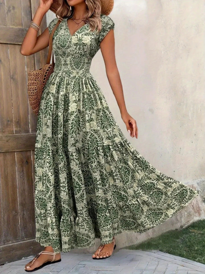 Smocked tiered maxi dress with cap sleeves and side slit
