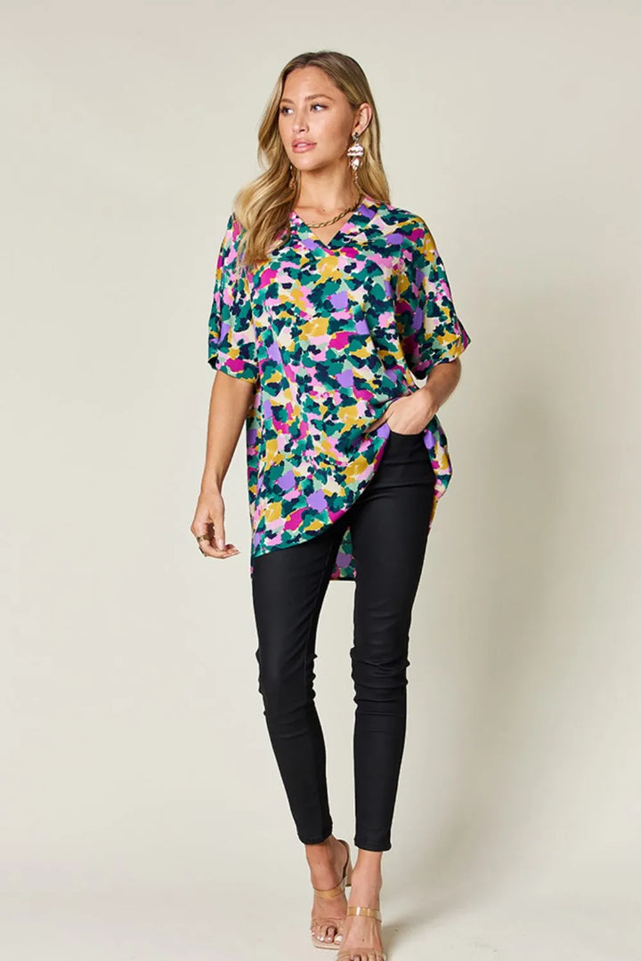 Abstract print v-neck tunic top with flutter sleeves and side slits
