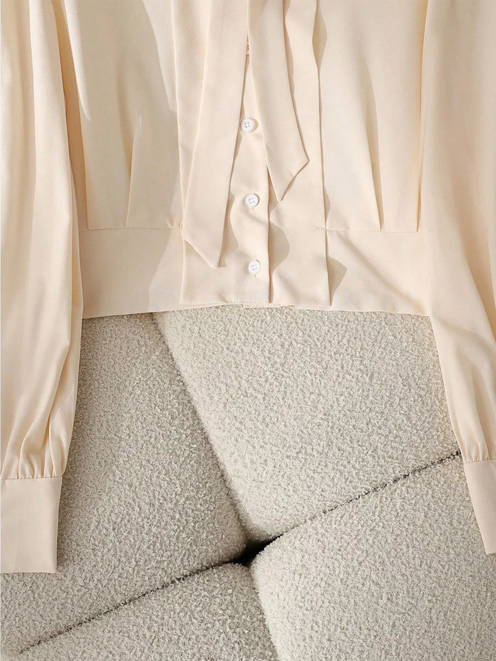 Puff sleeve bow-tie neck button-front blouse