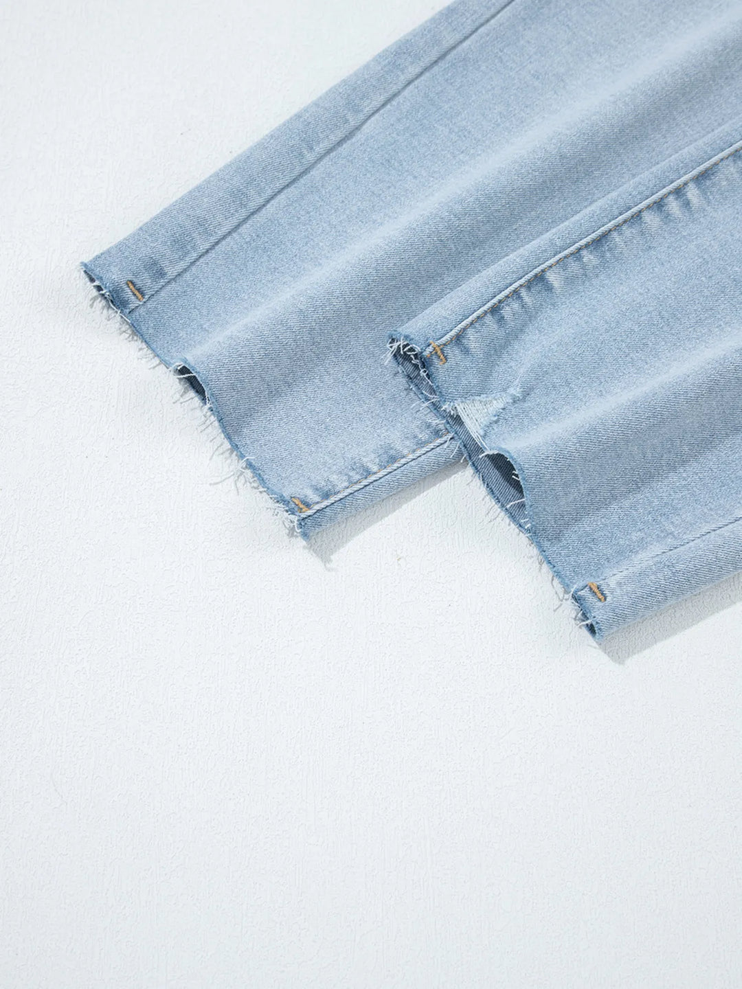 Distressed mid-rise ankle skinny jeans with raw hem